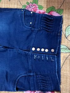 Dark Blue Jeans With Cut On Left Leg..