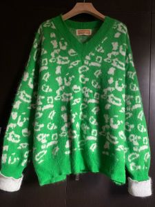 Green Jumper with White Accents