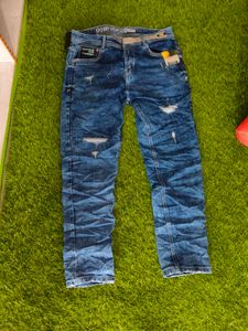 Distressed Blue Denim Jeans