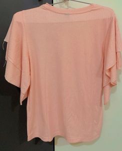 Pink Top With Ruffled Sleeves. Looks Great