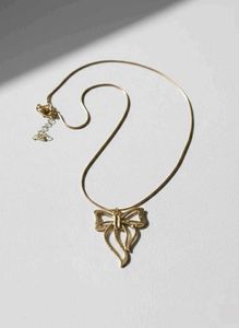 Gold Bow Pendant Necklace