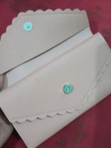A Very Beautiful Handbag In Peach Colour