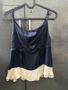 A Navy Blue &amp; Cream Coloured Tank Top.