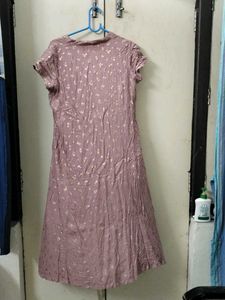A beautiful peach pinkish kurti