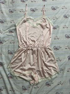 Vintage-Inspired Pink Satin Romper with Lace Trim
