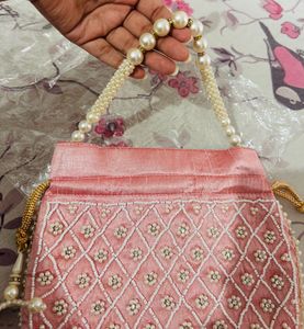 Regal Pink Pearl Potli Bag with Embellished Handle