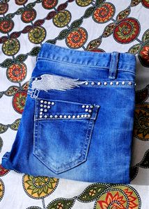 Girls ripped embroided jeans like new.