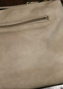 cream colour sling bag