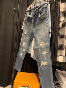 jeans in the photo have a distressed, ripped s
