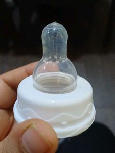 Nipples &amp; Caps Of Feeding Bottles