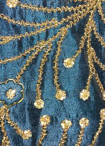 Its a Blue Dress.. With Beads Work On It.