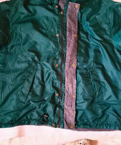 Green hooded windbreaker