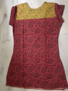 New kurti ....maroon colour printed pure cotton...cap sleeves...Round neck...no flaws...own factory made