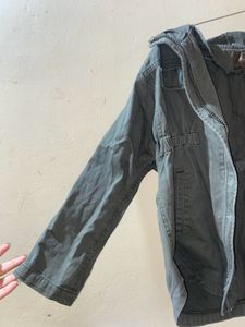 A Green Jacket For Both Girls And Boys