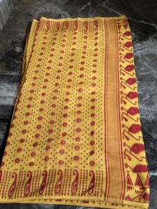 Elegant Yellow Saree with red Blouse.