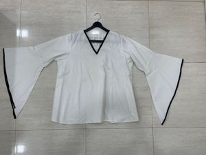 🌟 Monochrome Magic: Bell-Sleeve Statement Top! 🤍