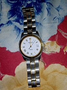 A gold and silver shining tissot watch