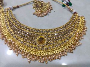 Golden Colour Choker With Earring Pair And Tika
