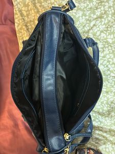 Yelloe V Shaped Zip Blue Hand Held Bag