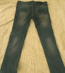 Worn Blue Denim Jeans