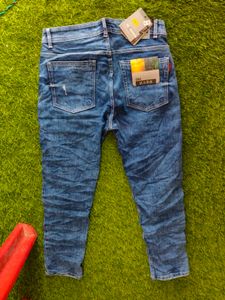 Distressed Blue Denim Jeans