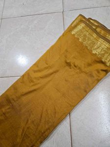 Elegant Mustard Saree with Gold Border