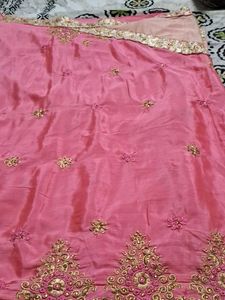 It Is Pink Color Georget With Golden Net Border .