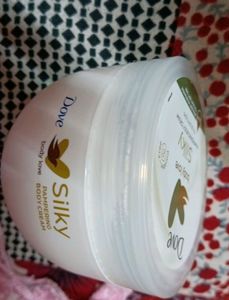 it is a moisturizer, new, unused, dove silky pampering cream body love