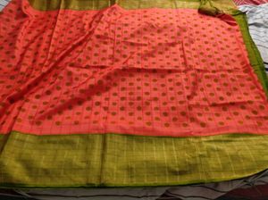 orange and green pocham.palli silk saree