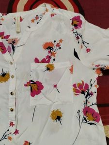 A White floral shirt top