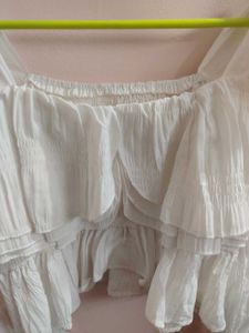 white bell bottom sleeves top.