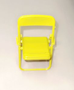 A miniature yellow folding chair Stand