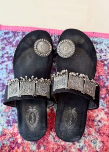 Elegant Black Ethnic Sandals with Ornate Silver Em