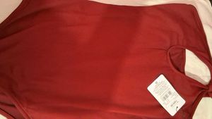 One-Shoulder bodysuit with tag.