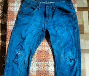 Distressed Blue Denim Jeans