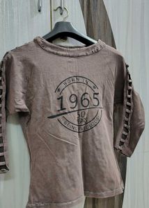 A Brown Top With Sleeves Detailing