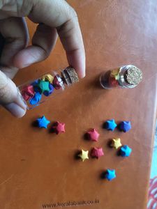 Glass Jars Filled With Paper Stars