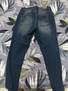 Ripped Blue Denim Jeans