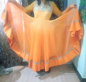 A very pretty orange and yellow double shaded full flayar anarkali with chudidar and pretty orange dupatta