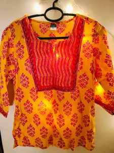 A Yellow Floral Print Tunic For Women