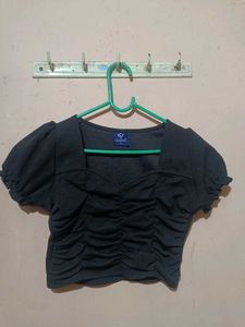 A Ruffled Black Crop Top