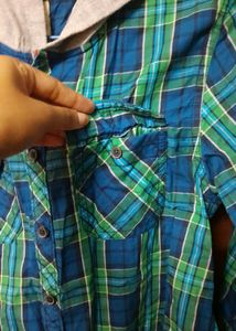Stylish boys&#39; shirt with an attached hoodie.