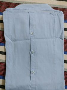 It is blue coloured formal shirt with very good fabric.