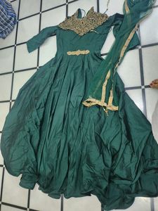 Luxurious Silk Dark Green Gown With Golden Stone