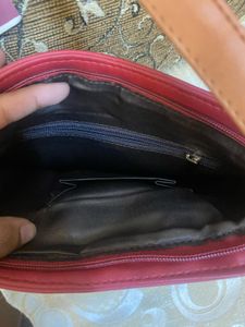Woman’s Cherry Colored Bag