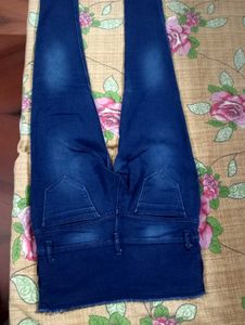 Dark Blue Jeans With Cut On Left Leg..