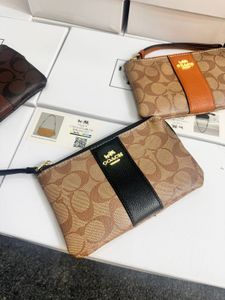 Coach Wristlet- Any 1