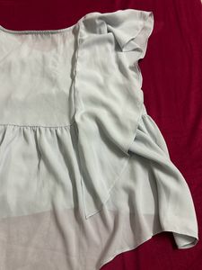 light blue frilled top