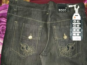 EMBROIDERED POCKET FLARED JEANS