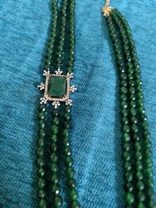 3 line Emerald chain with a locket.